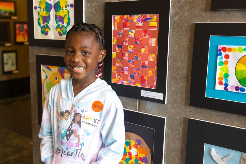 Students and their family at an art show